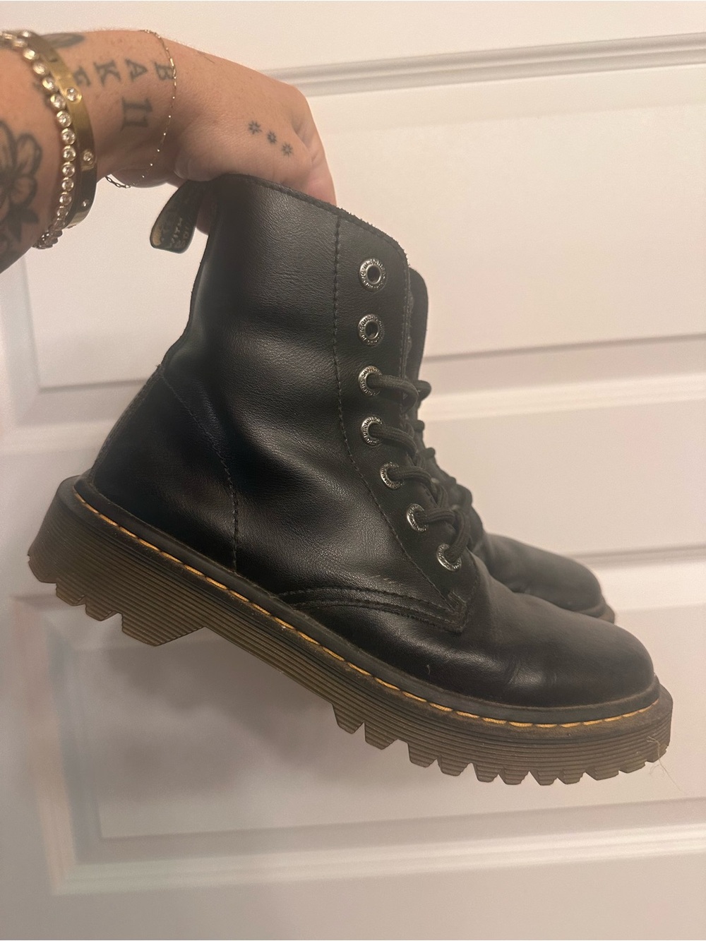 Dr. Martens Black Leather Lug Sole Boots with Yellow Welt Stitching